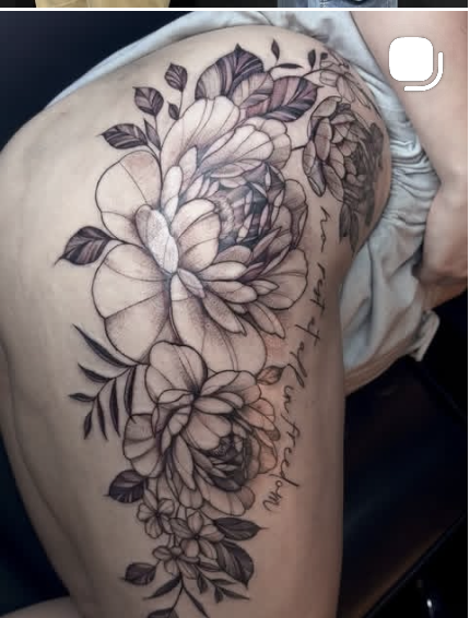 Fine line floral tattoo