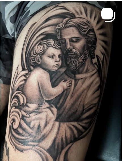 Black and grey portrait tattoo